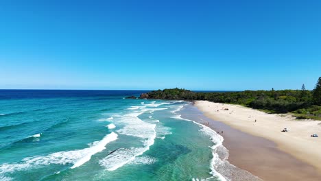 waves crashing on a beautiful sandy beach