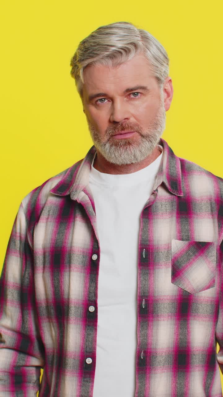 Mature man facepalm gesture tired expression of frustration deep exhaustion comedic annoyance