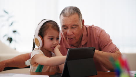 Senior-man,-child-and-learning-with-tablet