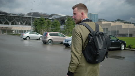 man walking in parking lot