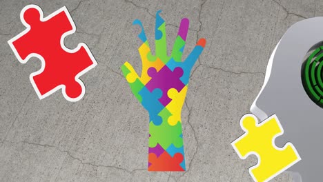 animation of autism colourful puzzle pieces forming hand and head with labyrinth