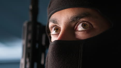 Terrorist-hiding-identity,-conducting-guerilla-warfare-operation,-close-up