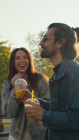 friends enjoying juice drinks outdoors