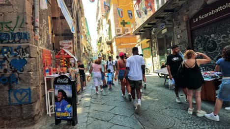 people enjoying street life and maradona tribute