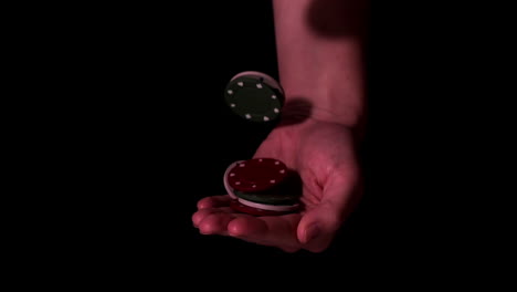 poker chips falling into hands