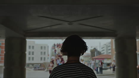 back view of a teen in venice - archway silhouette