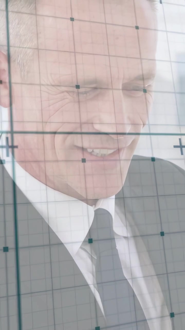Vertical video: Man tapping phone and causing grid with crosshair moving over face for business