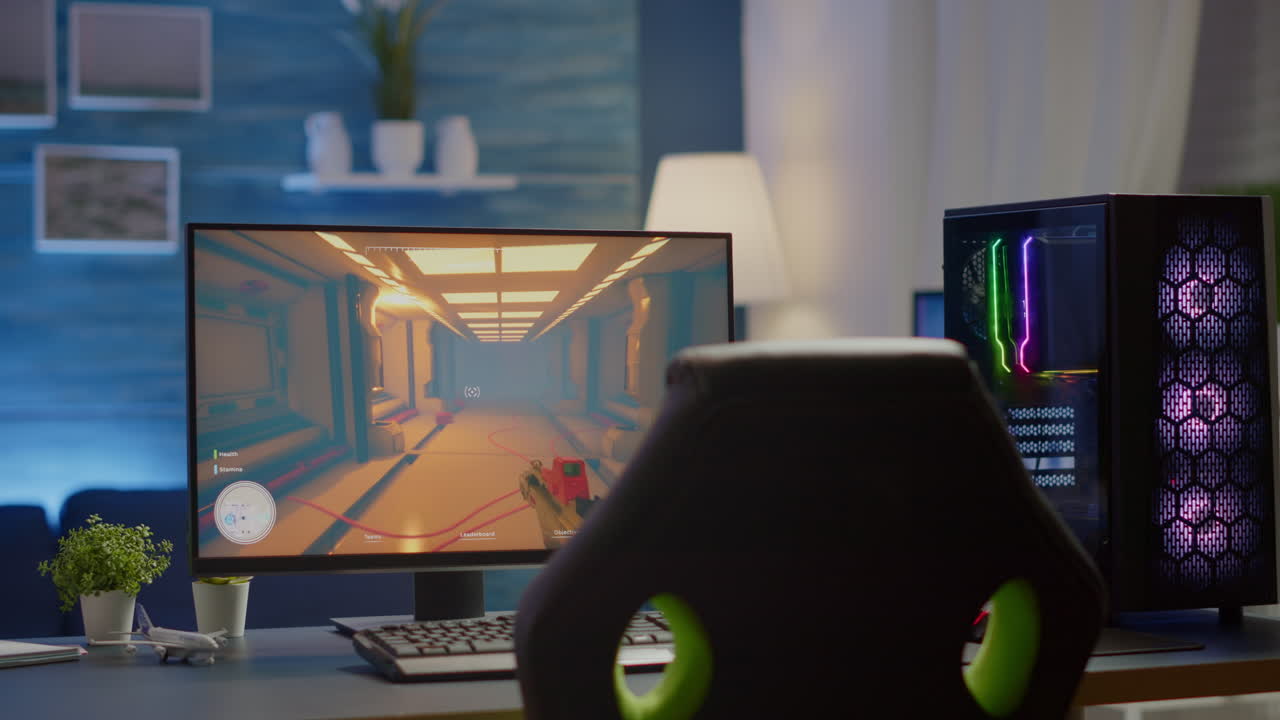 RGB powerful computer gamer rig with FPS videogame on screen
