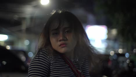 close-up of an asian girl in a nocturnal scene