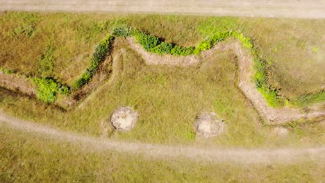 Aerial-view-of-giant-bat-field-at-Natterer's-Wood,-Suffolk---drone-ascending-shot