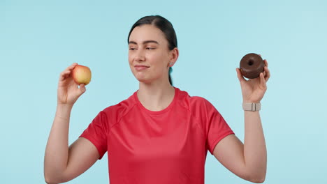 woman, apple and donut in diet choice