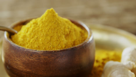 turmeric powder in bowl on a plate 4k