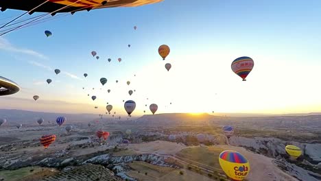 Capture Cappadocia's beauty with a sunrise hot air balloon flight over dramatic rock formations and valleys