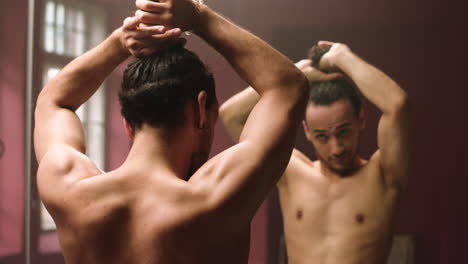 young man in front of a mirror