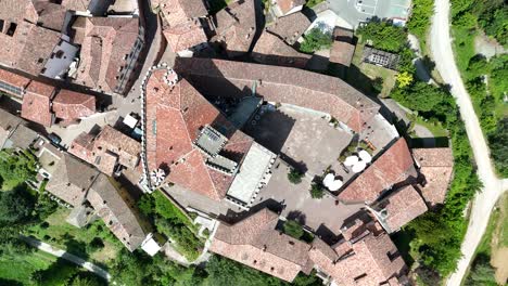 barolo castle in langhe wine region, cuneo, piedmont, italy. 4k aerial view top down zenital spiral, above the castle.