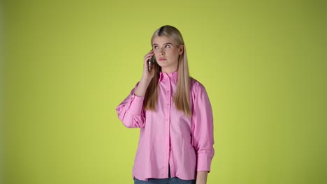 nervous, fearful blonde woman try to call someone important on smartphone