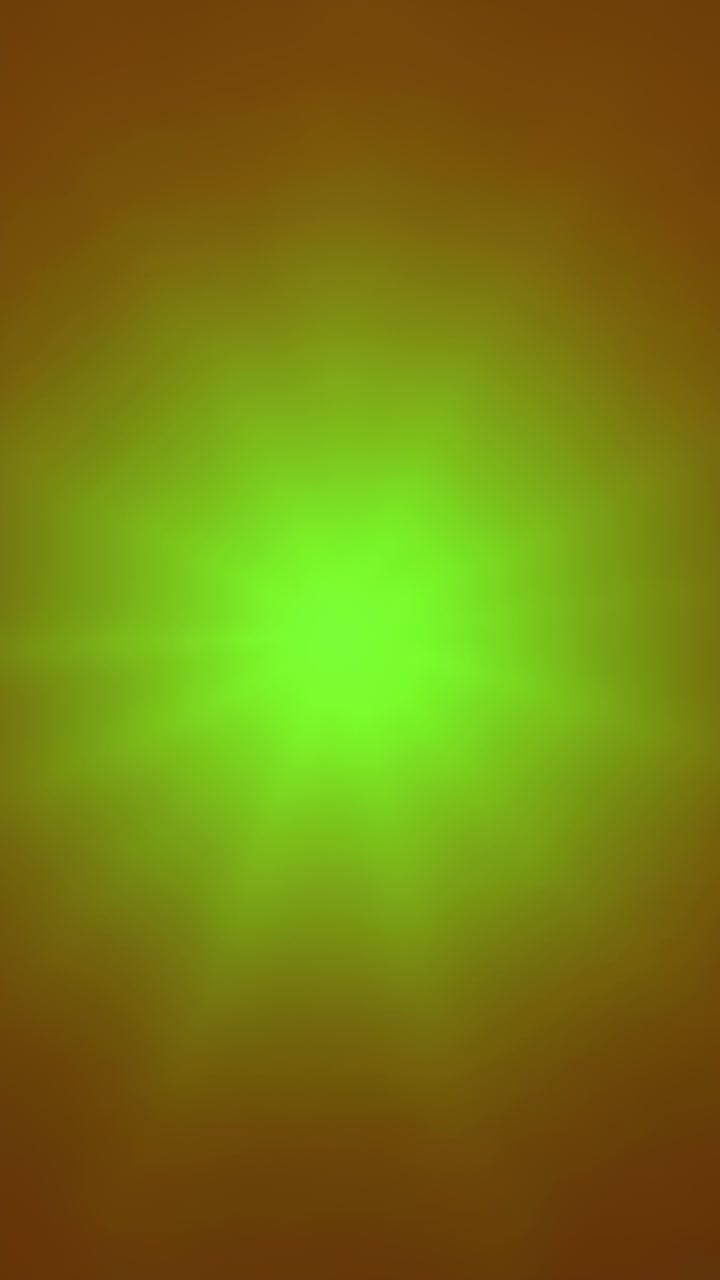 Vertical video: On play, neon burst pulsing and edges sharpening on brown backdrop for screen glow