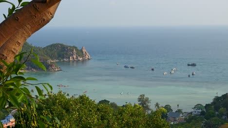 Stunning-high-above-panorama-view-on-open-ocean-with-boats-on-tropical-island