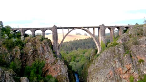 aerial dolly view of gundián viaduct spanning ulla river in galicia