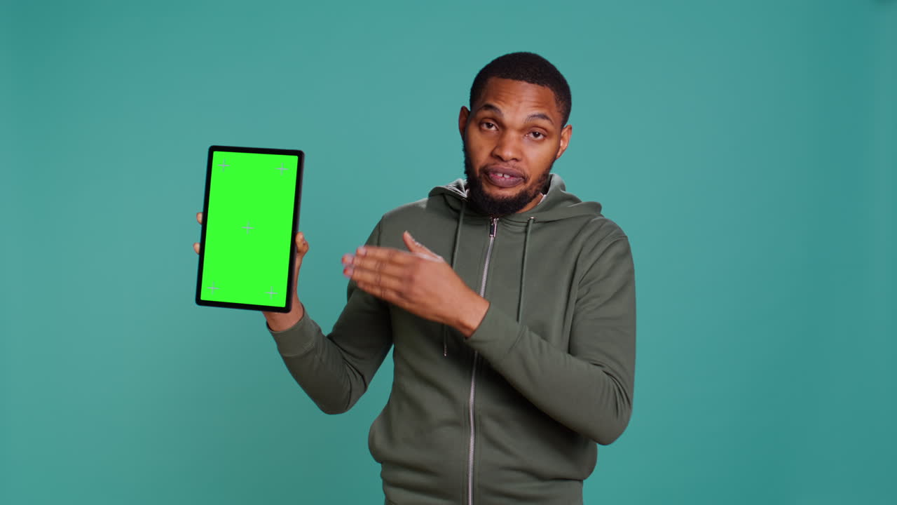 Happy influencer holding isolated screen tablet, doing recommendation