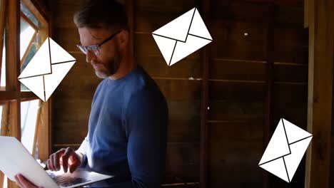 man typing on a laptop in the attic 4k