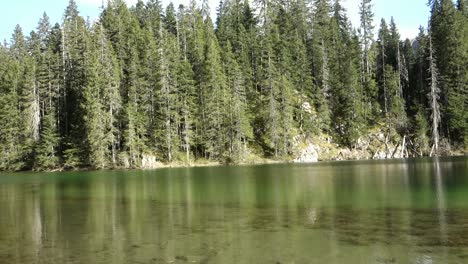 sunrays reflects on surface of zminje lake in durmitor national park, zabljak, montenegro