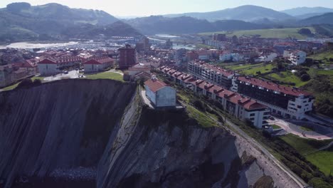 dramatic geology: steep slab rock cliff on flysch beach, zumaia spain