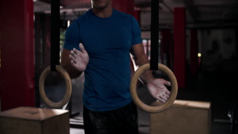 man doing ring dip exercises using gymnastic rings