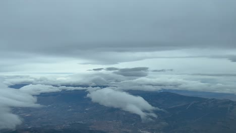 Dramatic-winter-sky,-a-pilots’-point-of-view-in-a-real-flight,-full-of-snow-clouds