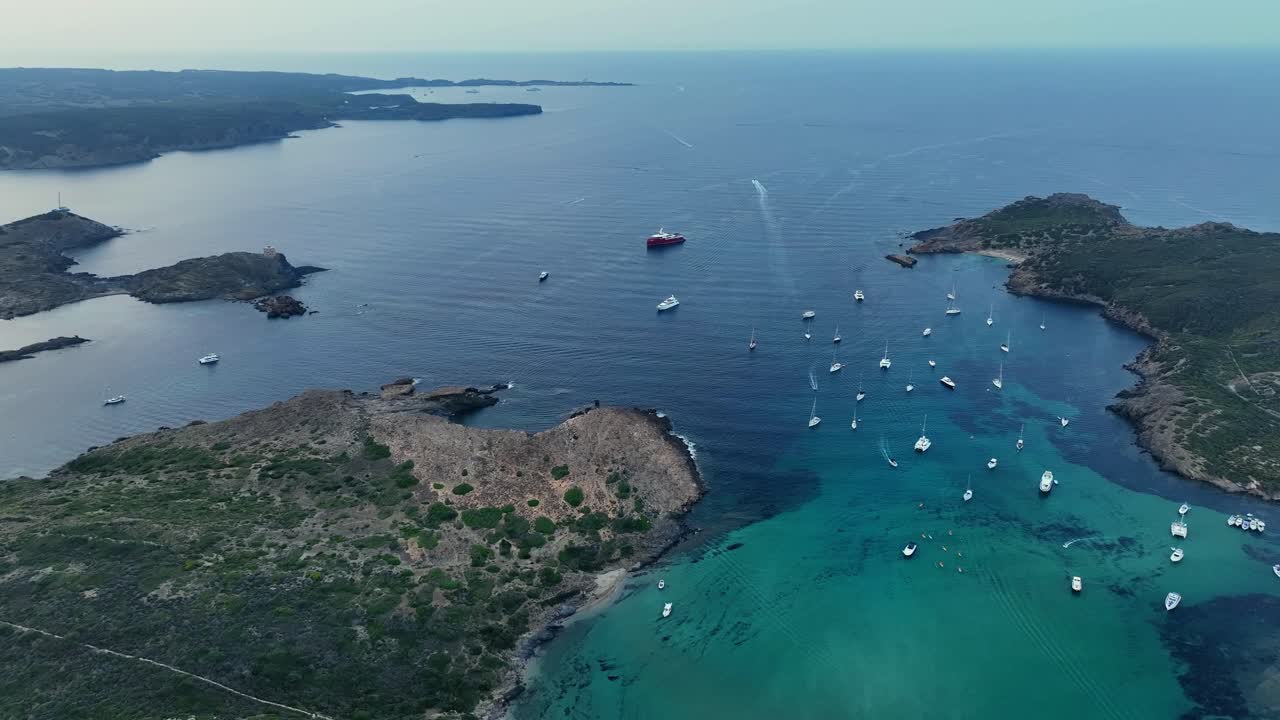 Drone shot of the scenic environment of coast and water at Menorca.