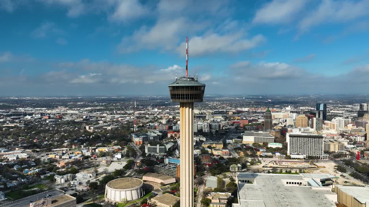 Drone rising around the Tower of the Americas, sunny day in San Antonio, TX, USA