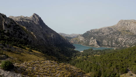 mountain valley in mallorca with gorg blau water reservoir in distance