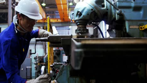 male engineer working in workshop 4k