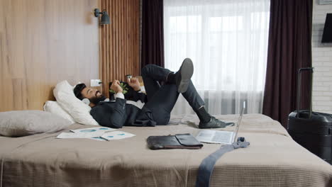 businessman relaxing in hotel room