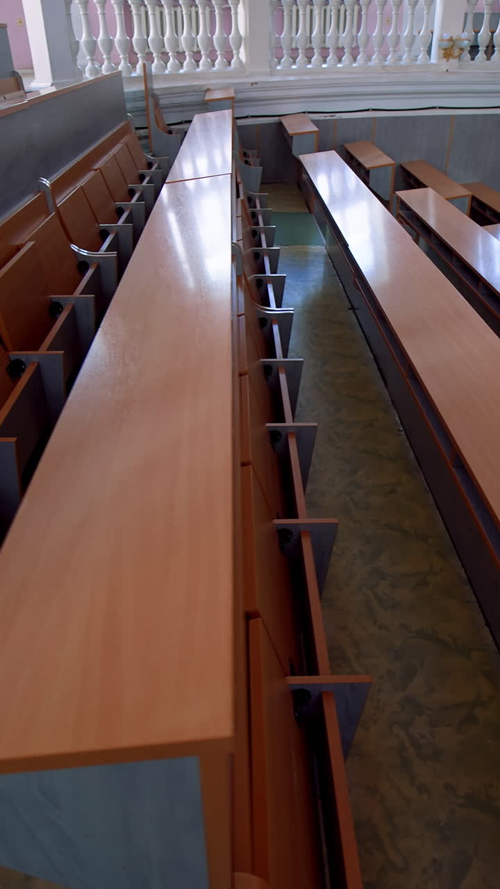 Empty lecture hall in University. Shot of empty college lecture hall in university. Vertical video
