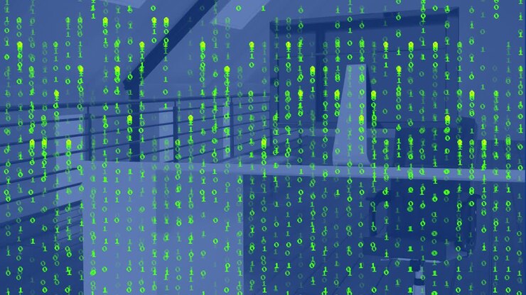Animation of green falling binary codes over desktop and unoccupied chair in office