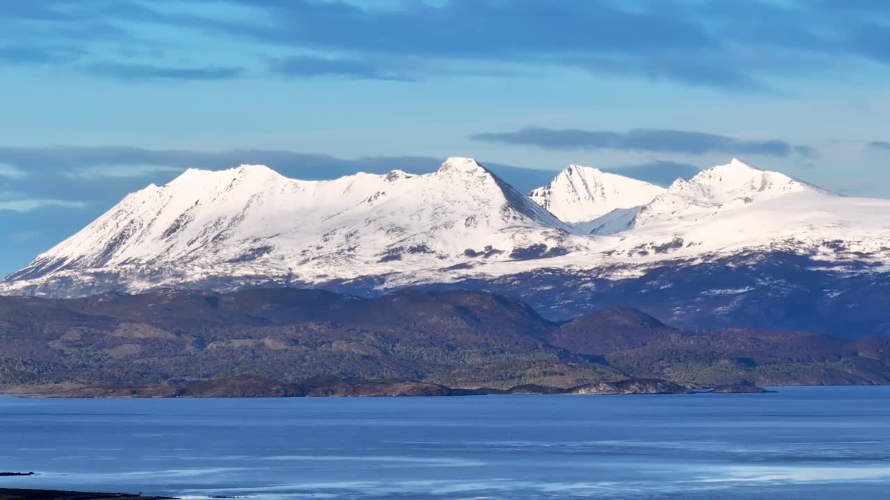 Majestic Snow-Capped Mountains Overlooking a Fjord