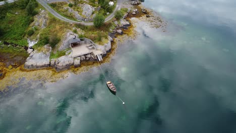 Beautiful-footage-of-a-boat-laying-tied-down-in-a-Norwegian-fjord