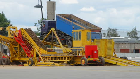 unloading truck at processing plant. processing industry. factory processing