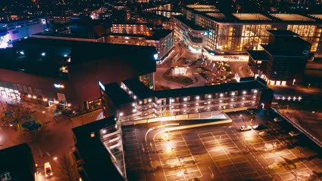 Aerial-hyperlapse-showing-buildings,-cars-and-city-landscape