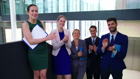 Business-executives-applauding-after-presentation