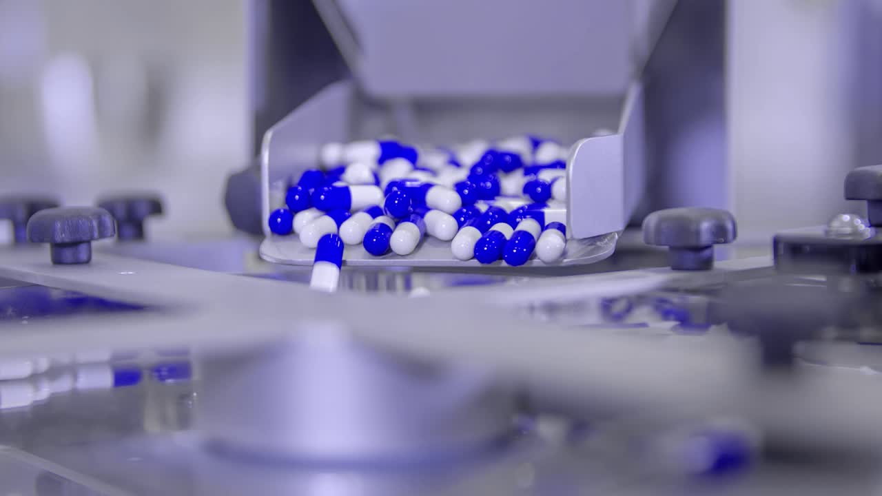Extreme closeup of blue pills for COVID-19 treatment its mass production line