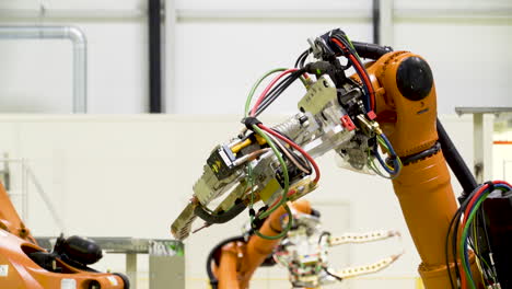 industrial robots in a manufacturing facility