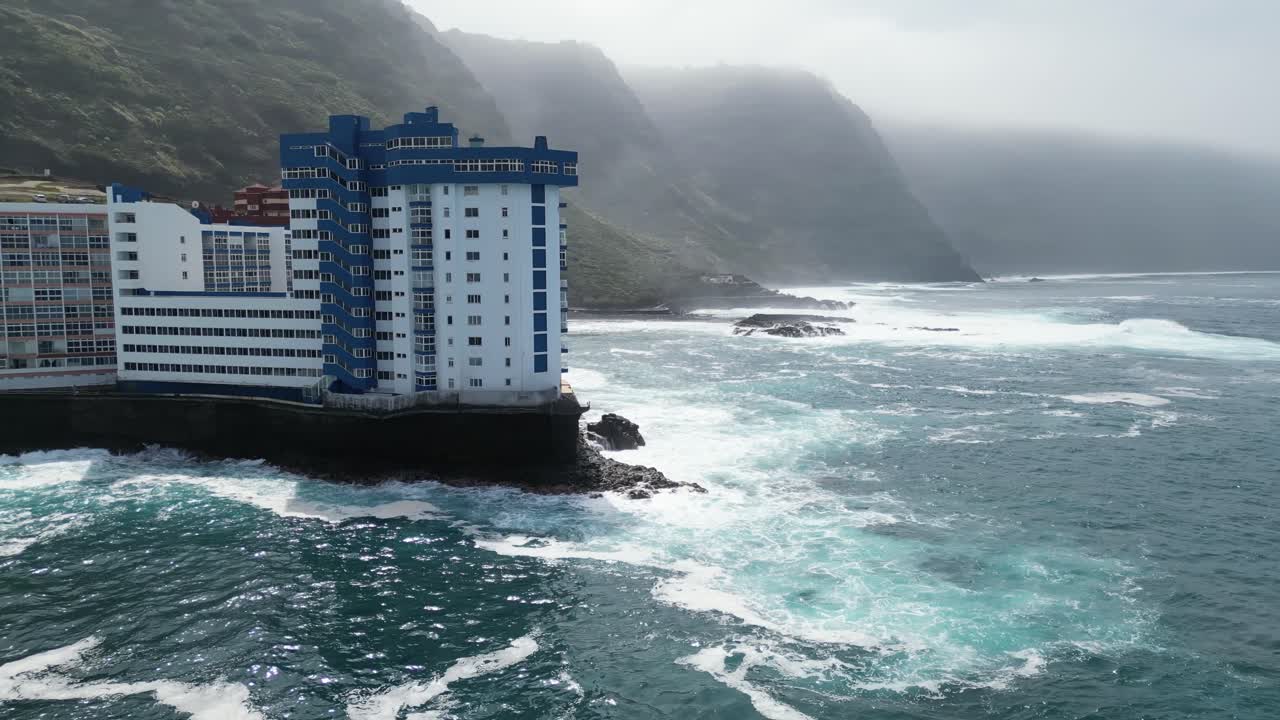 Inside the wave apartments in Mesa del Mar natural sea water pool area in Tenerife Canary islands Spain, Aerial overlook shot