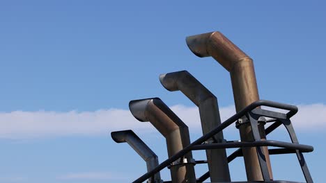 chimneys with smoke against a clear sky