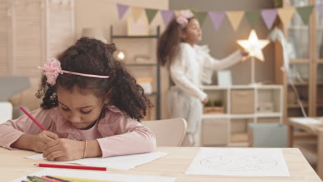 girl drawing when blurred friend jumping