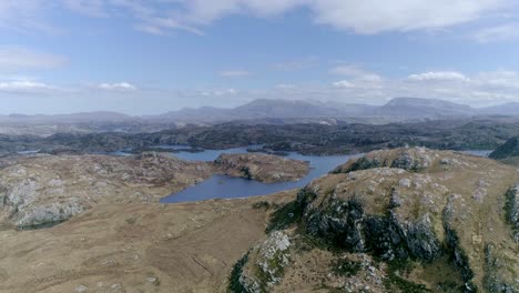 Aerial-moving-through-a-stunning-mountainous-landscape