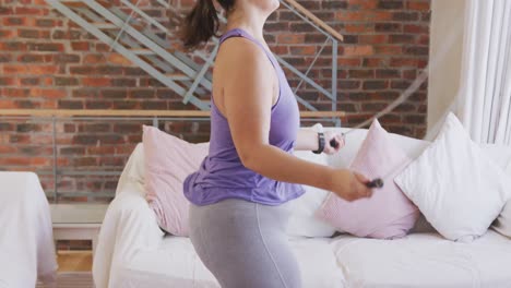 Caucasian-vlogger-female-exercising-at-home