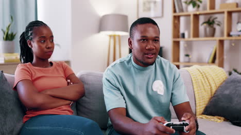 couple, annoyed and a man gaming in the living