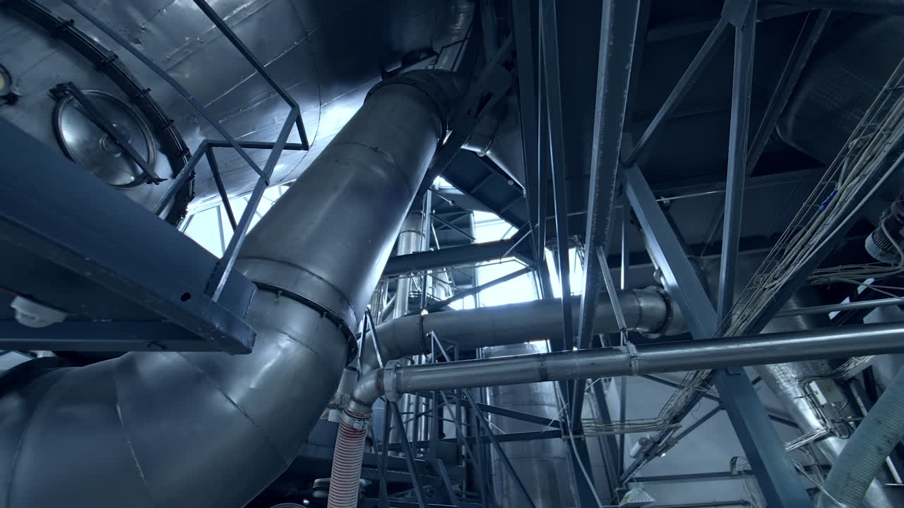 Diary food industry milk production. New technological milk factory with steel tubes.